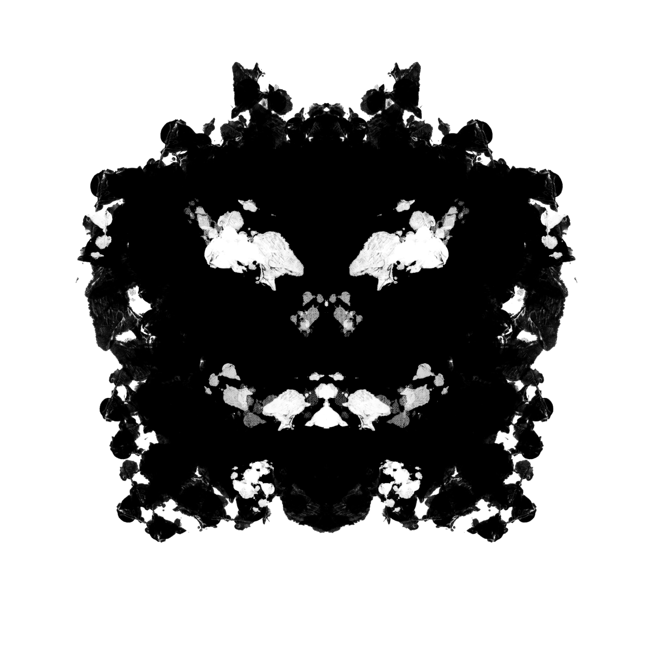 Ink blot that looks like a sinister face.