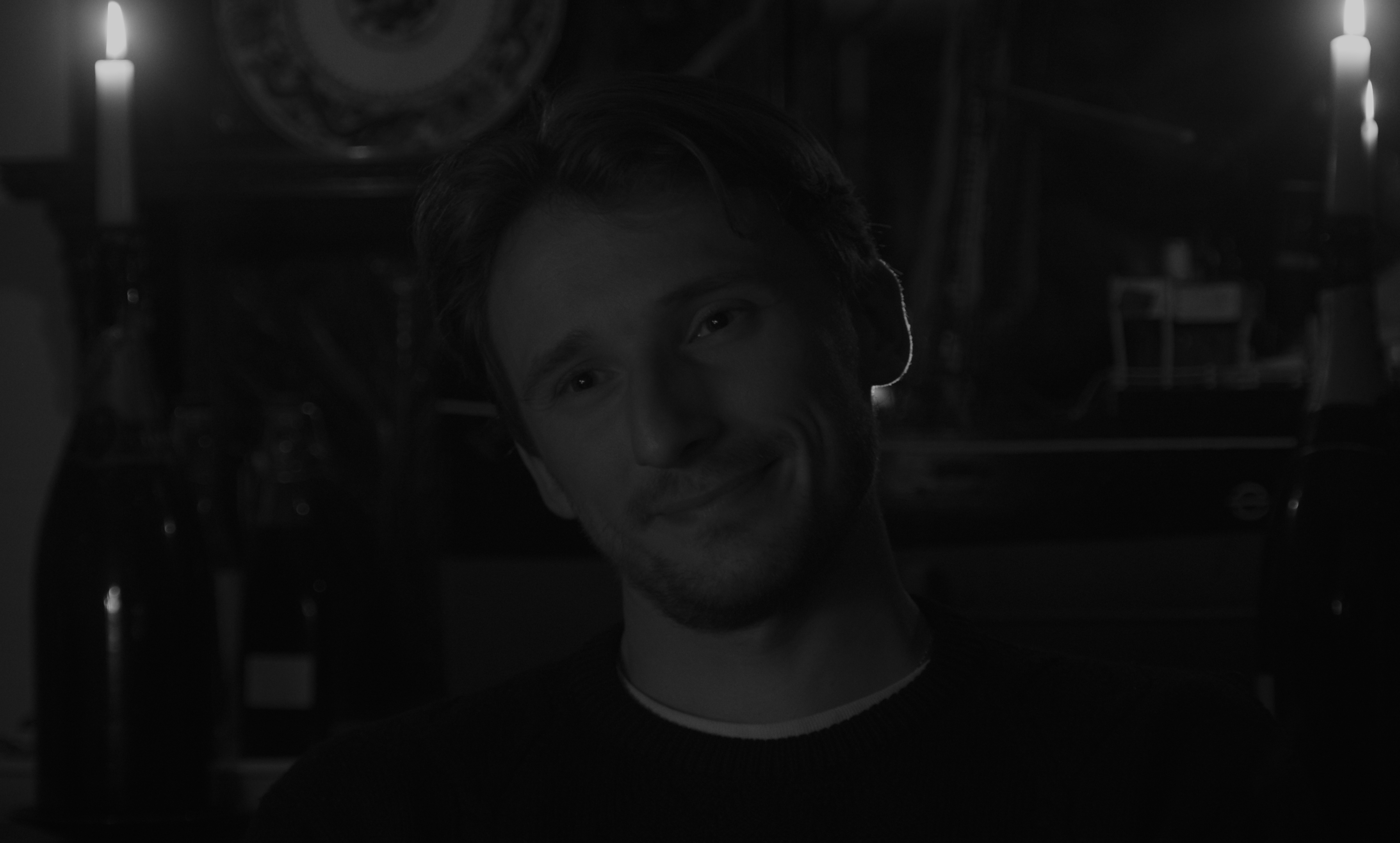 A man looking at something tenderly.